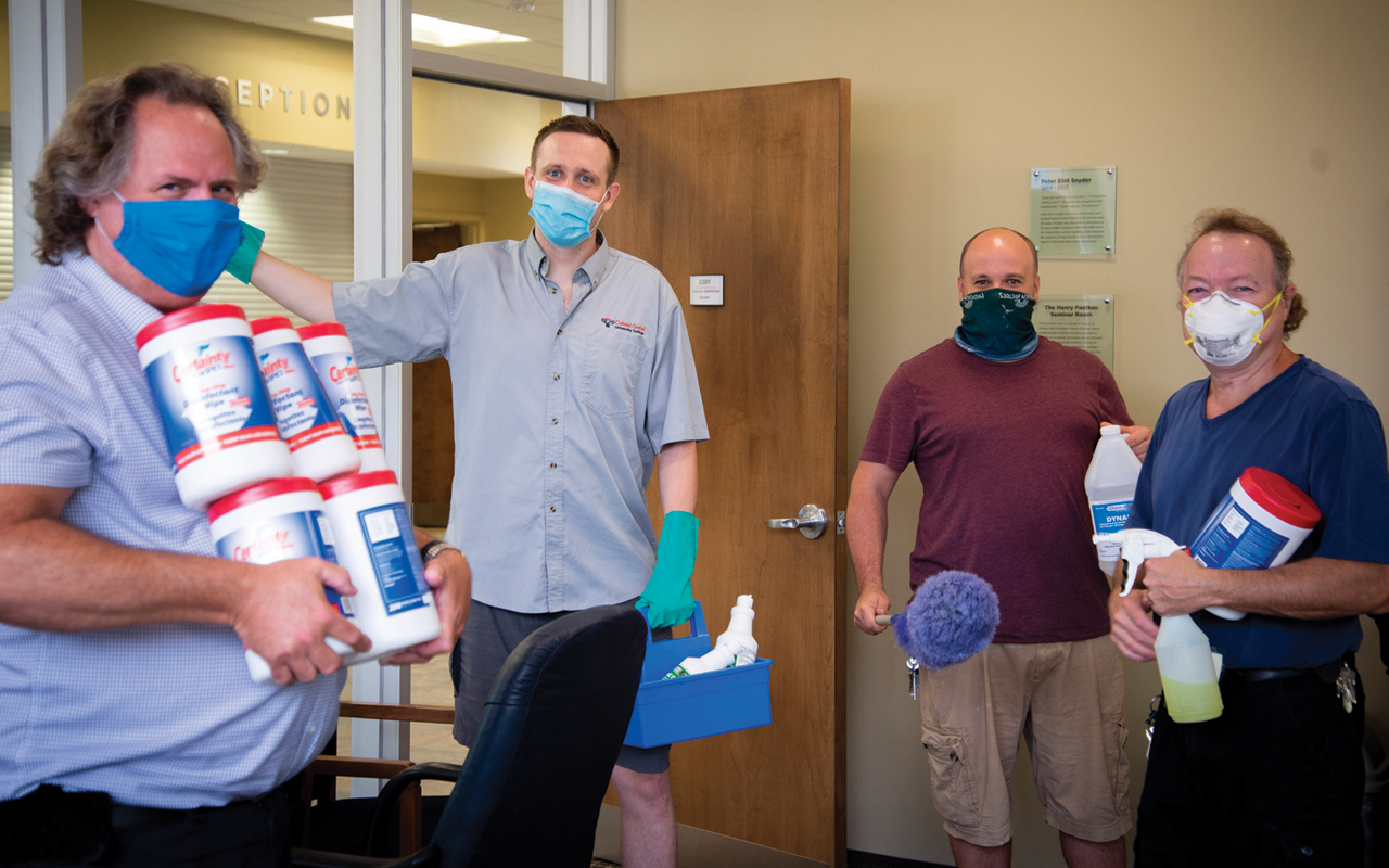 Conrad Grebel University College custodians Paul Penner, Levi Flaming, Peter Hart and Devon Grainger return to work Aug. 4 to prepare for residence students to return to campus in September. — Conrad Grebel University College