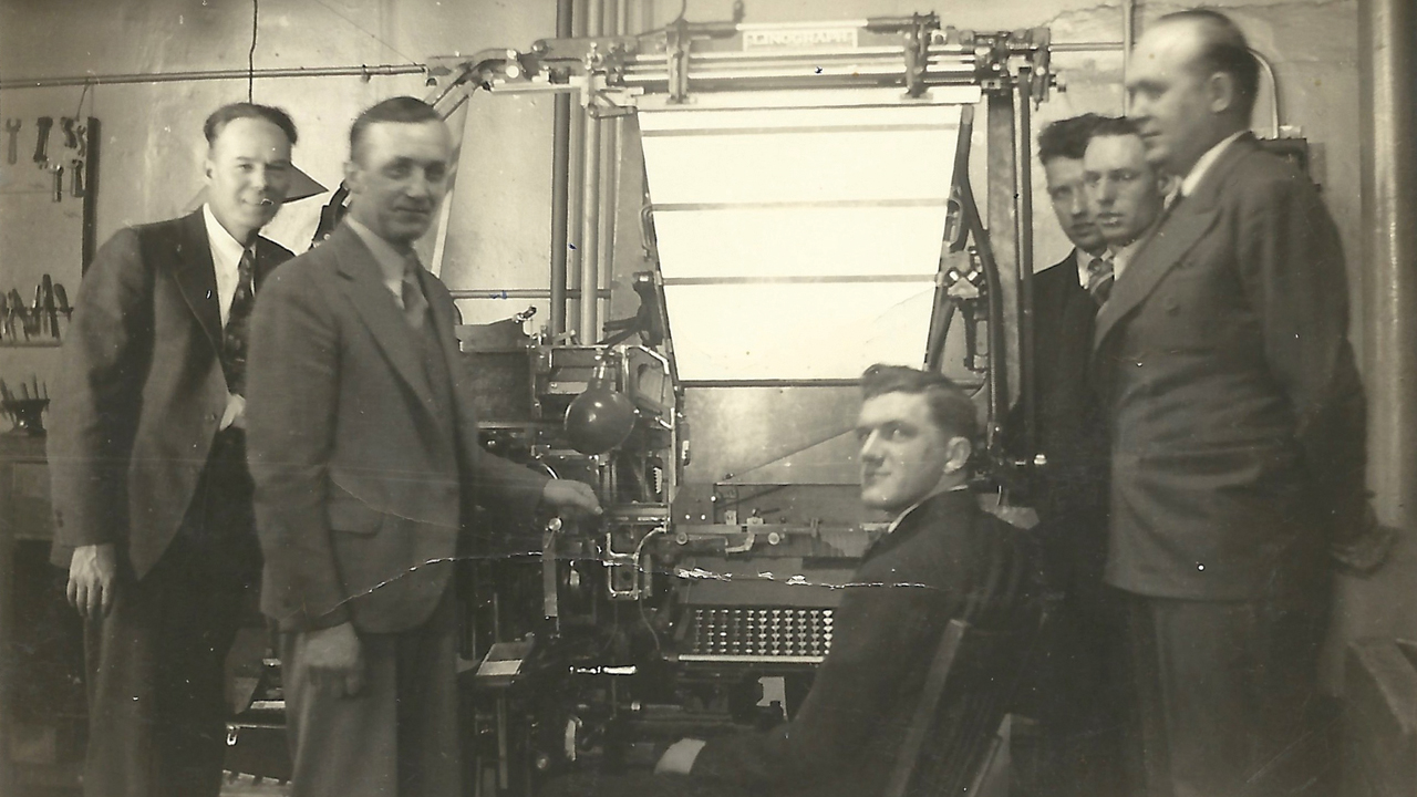 Employees in the print shop of Herald Publishing Co., publisher of Mennonite Weekly Review, 1938. — Mennonite Weekly Review