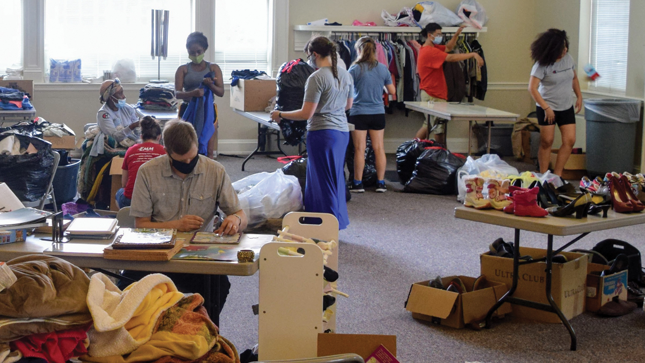 Youth from Mountville Mennonite Church sort supplies that are arriving at Trinity Lutheran Church — Andrew Mashas/EMM