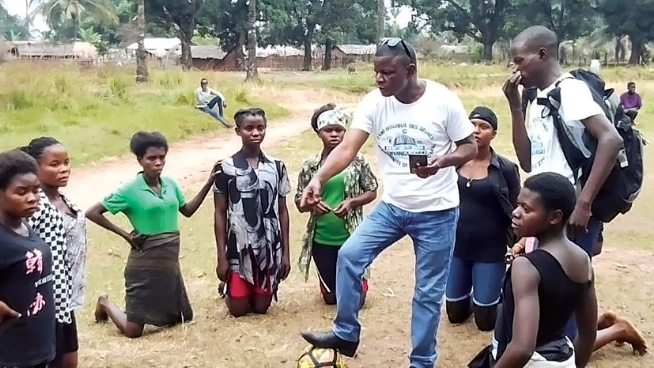 Robert Irundu coaches some members of the women’s soccer team at the Bible camp in Nyanga, Democratic Republic of Congo. — Africa inter-Mennonite Mission/Mennonite Mission Network