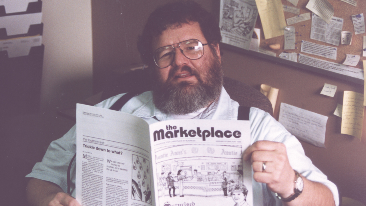 Wally Kroeker checking if any typos appeared after The Marketplace was printed in 1995. — Wally Kroeker