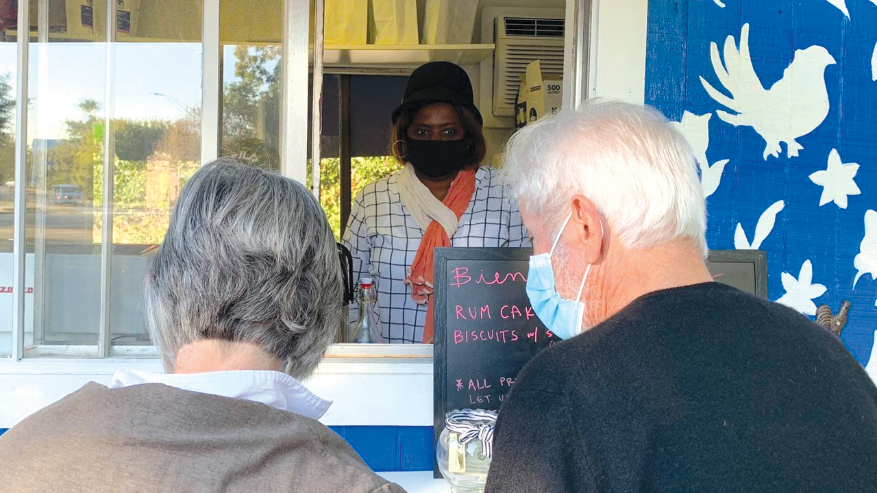 Kabibi Bamuamba serves customers at San Antonio Mennonite Church’s new Café Cotidiano coffee trailer. — Katie Best/San Antonio Mennonite Church