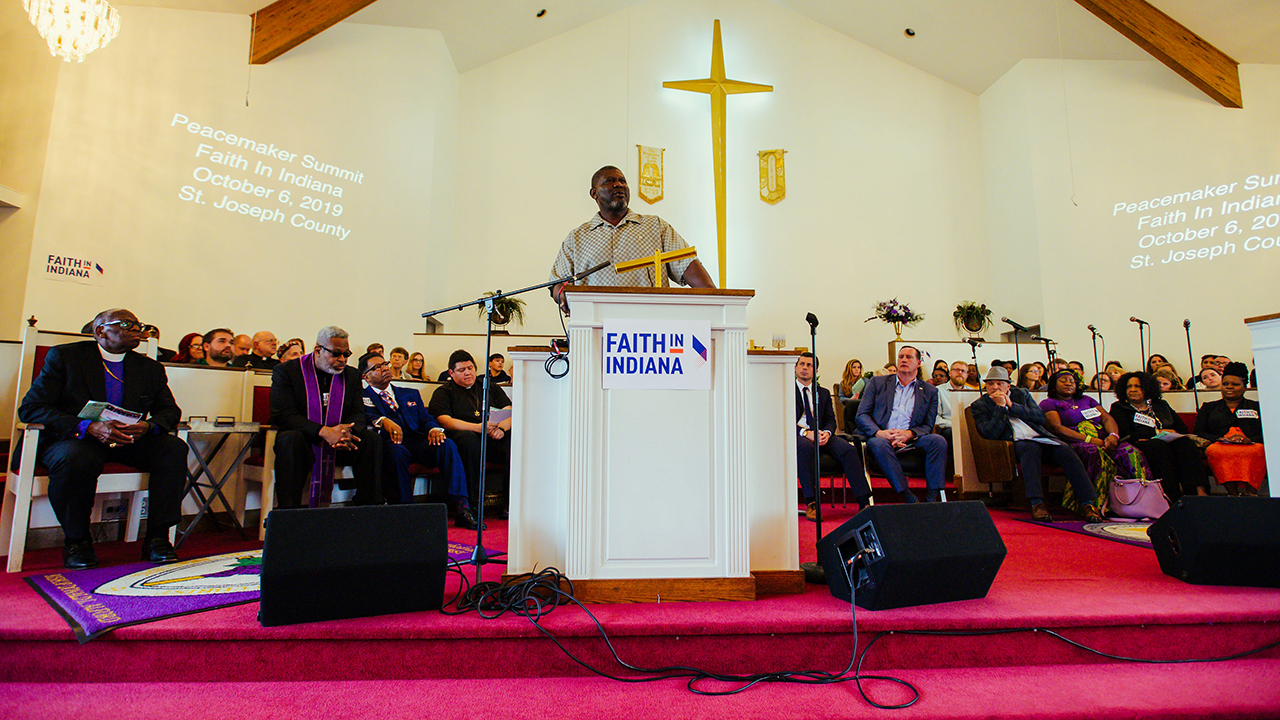 Tyree Bonds, brother of Eric Logan, killed by a South Bend police officer, addresses the Peacemaker Summit organized by Faith in Indiana as public officials and clergy listen on Oct. 6, 2019. — Adam Raschka