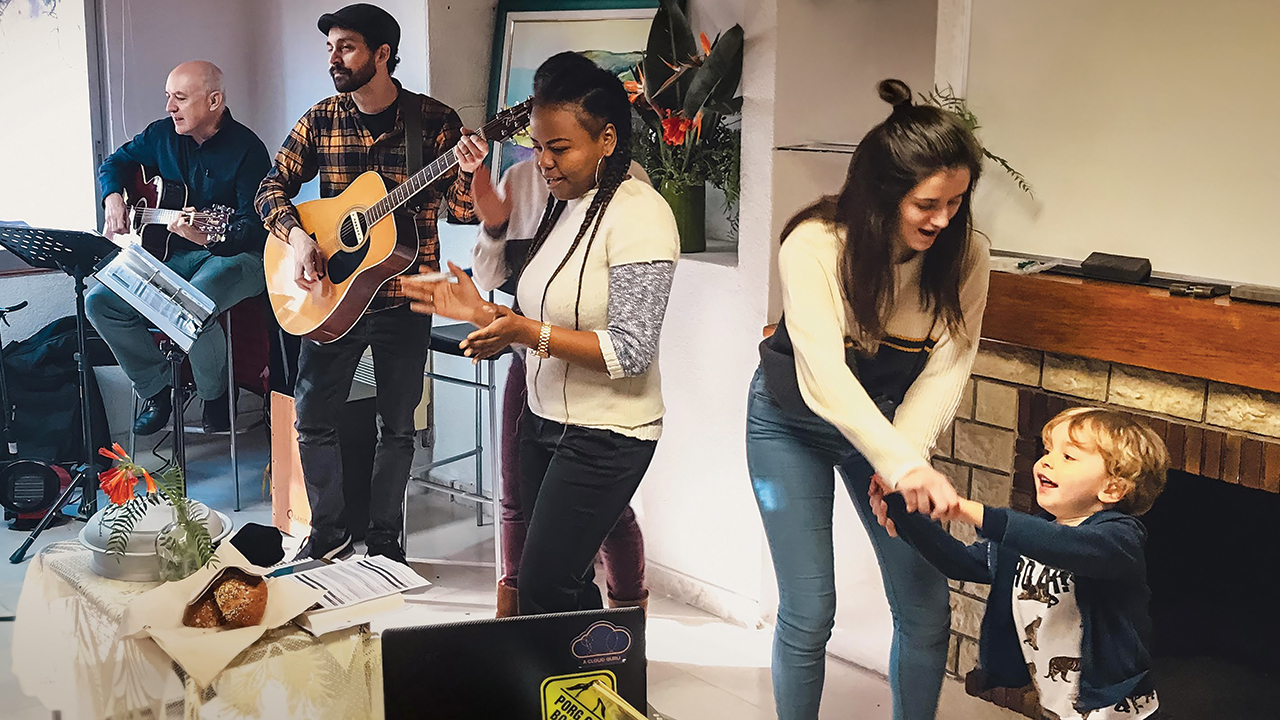 Joshua Garber, second from left, and church youth lead worship at a gathering of the Mennonite Evangelical Community of Barcelona. — Alisha Garber