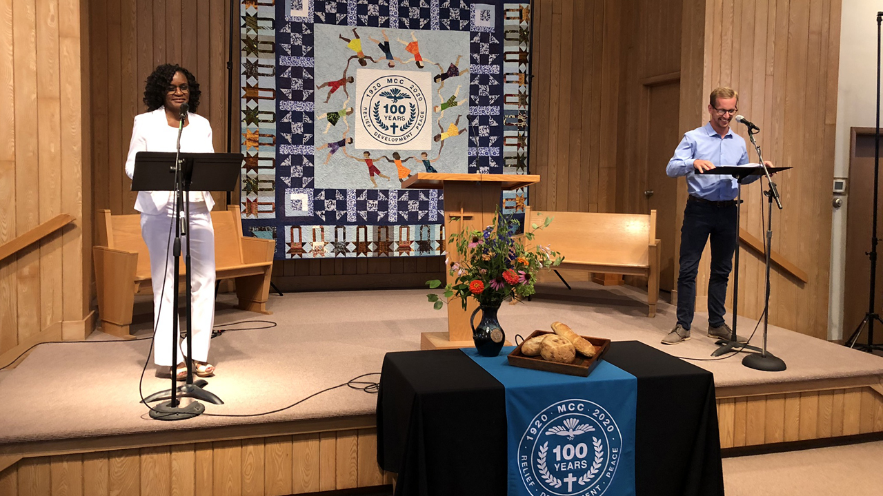 Cyneatha Millsaps and Quinn Brenneke, MCC alumni and co-pastors at Prairie Street Mennonite Church in Elkhart, Ind., take part in the MCC Great Lakes Centennial Service of Celebration, a livestreamed event held July 26. — J Ron Byler/MCC