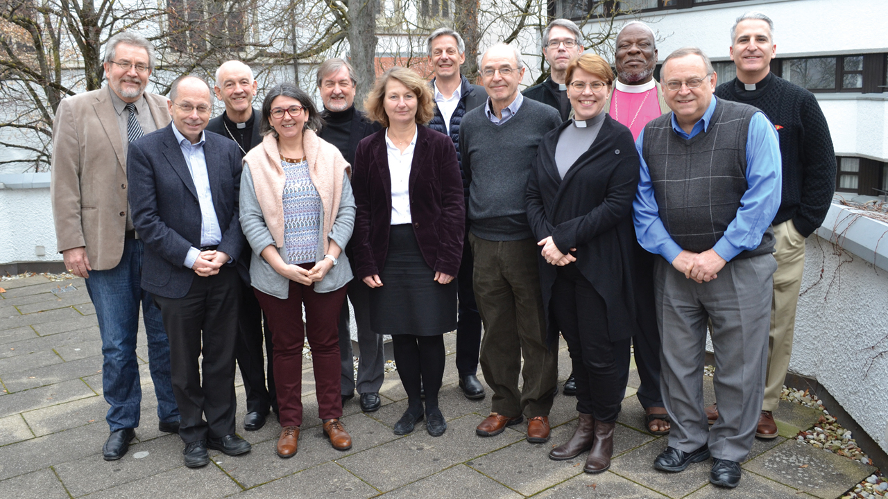 Representatives of the Lutheran-Mennonite-Roman Catholic Trilateral Conversation on baptism included, from left to right: Alfred Neufeld, Theodor Dieter, Luis Augusto Castro Quiroga, Marie-Hélène Robert, Larry Miller, Friederike Nüssel, Fernando Enns, John Rempel, Luis Melo, Kaisamari Hintikka, Musawenkosi Biyela, William Henn and Avelindo Gonzalez. — William Unger/MWC