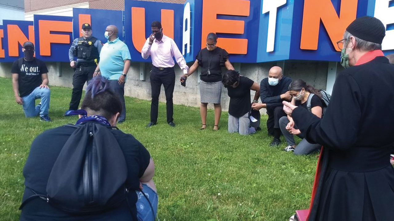 Clergy members pray May 31 in a photo associated with “A Pastor’s Protest Experience,” a firsthand account from Todd Gusler, pastor of Rossmere Mennonite Church in Lancaster, Pa., of his experience at a protest responding to the murder of George Floyd. — Todd Gusler/Anabaptist History Today