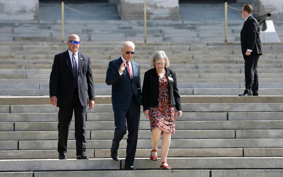Vice President Joe Biden walks with Sister Simone Campbell, right, before the start of the Nuns on the Bus tour, on Sept. 17, 2014, at the Statehouse in Des Moines, Iowa