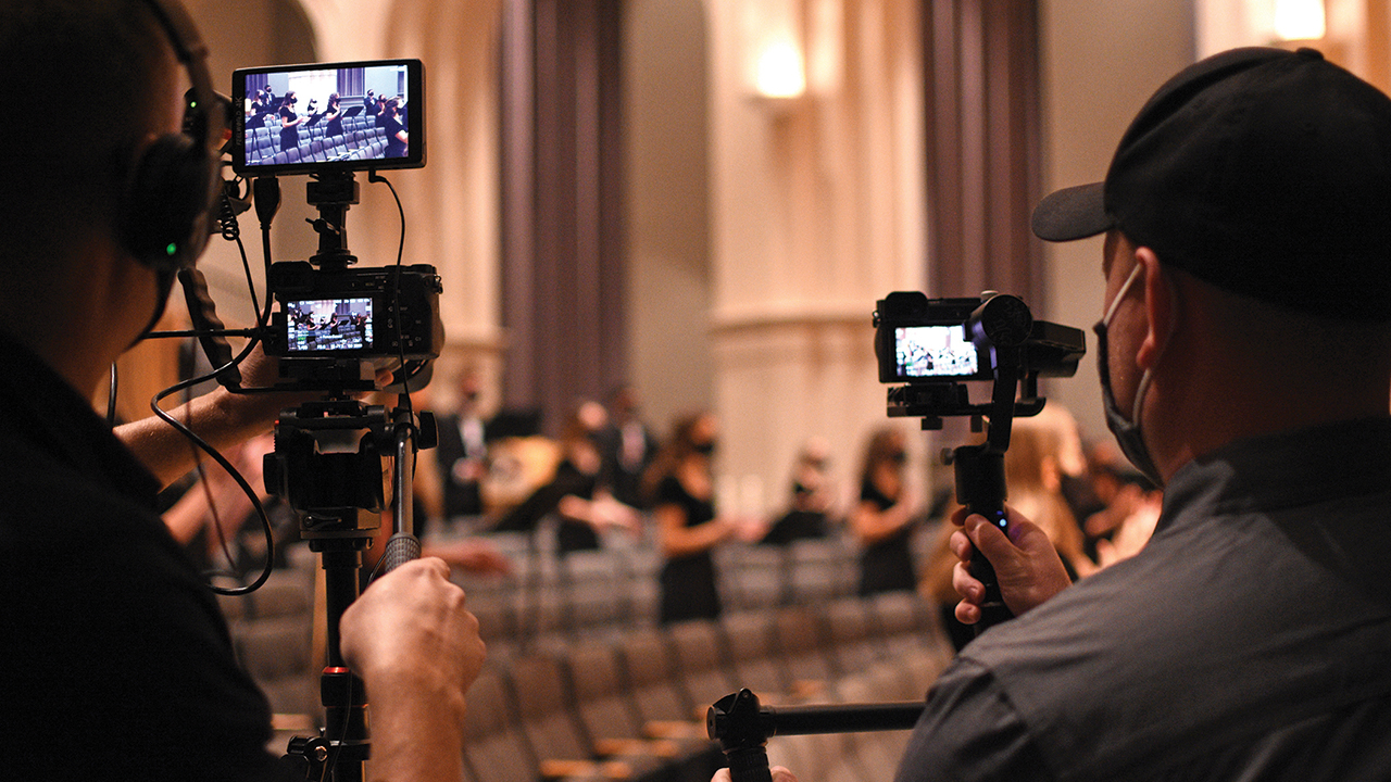 Bluffton University music education alumni and Modo Media co-owners Chad Stearns and Cody Ridenour film Bluffton students for a documentary about the history of performing Messiah on campus. — Claire Clay/Bluffton University