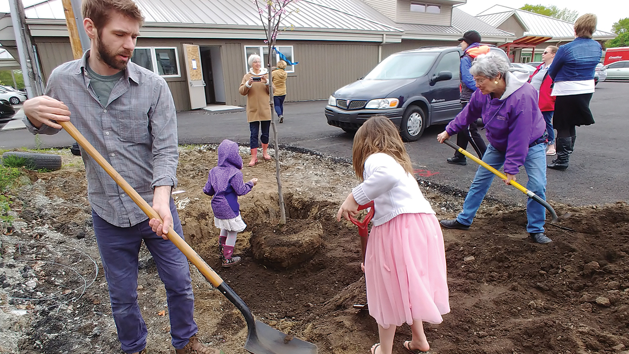Members of Assembly Mennonite Church in Goshen, Ind., plant trees as part of the church’s Sunday school time on May 12, 2019. — Glenn Gilbert/Assembly Mennonite Church