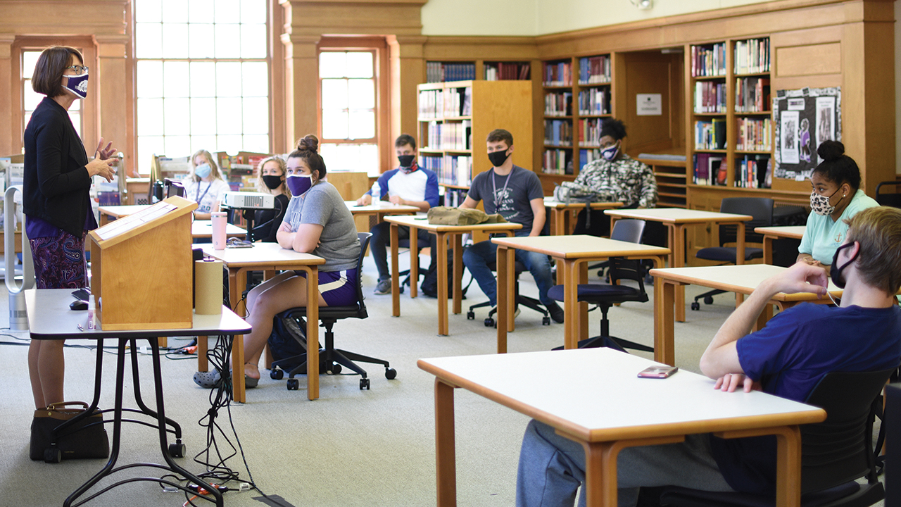 Bluffton University President Jane Wood speaks to students in LaShonda Gurley’s Becoming a Scholar first-year seminar class in the Musselman Library Reading Room, one of about a dozen campus spaces converted to classroom use to maintain COVID-19 distancing. — Claire Clay/Bluffton University