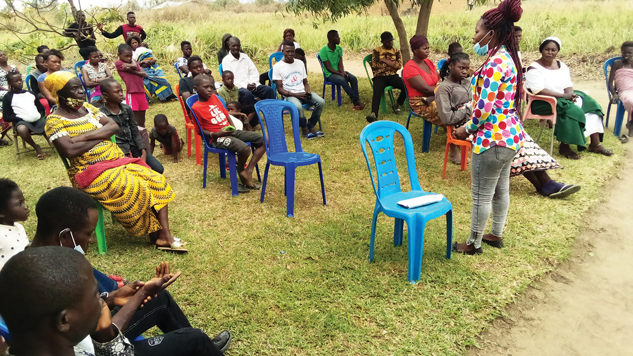 Francine Mukoko, the first university graduate from the Men­no­nite Church of Congo community in Bateke, presents public health advice in the local language of Teke. — Seraphin Kutumbana/MWC