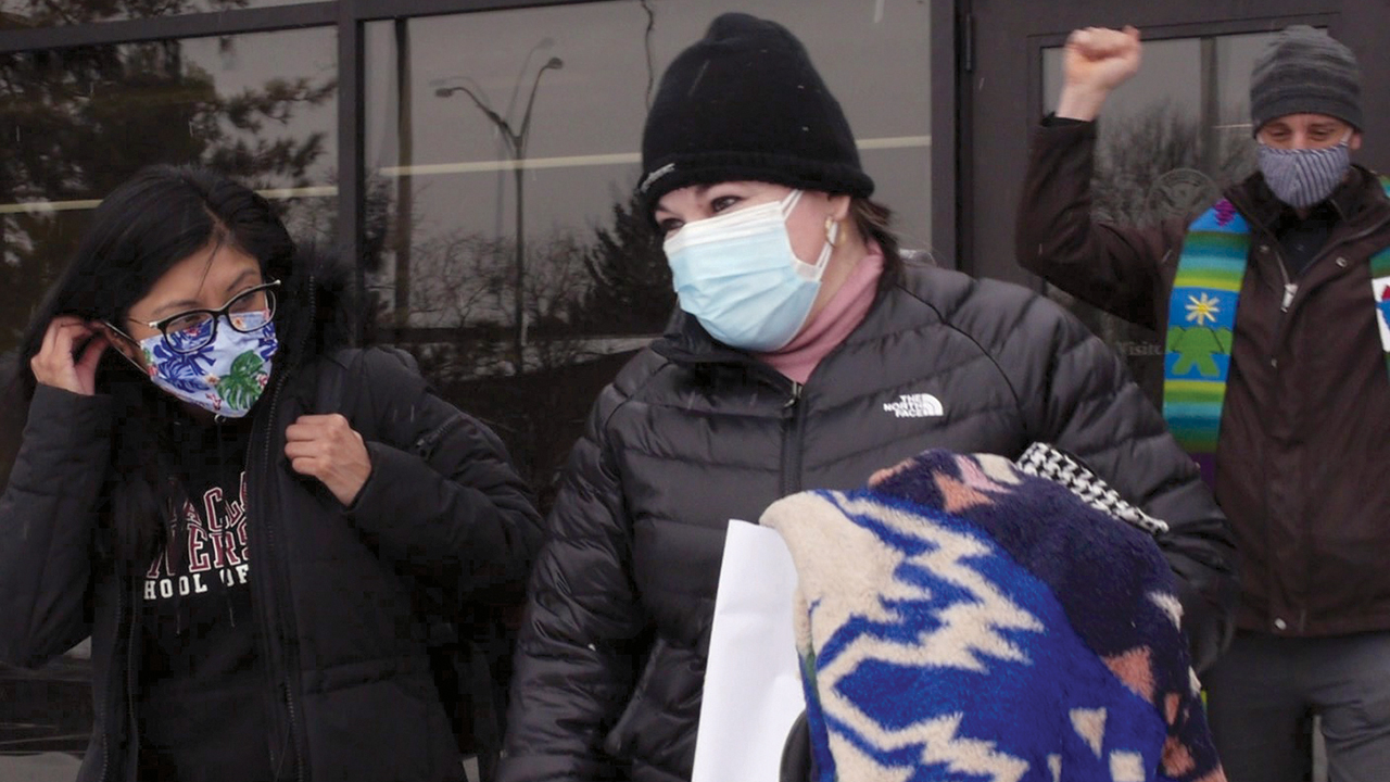 Edith Espinal, center, departs the Immigration and Customs Enforcement office in Columbus, Ohio, after leaving her sanctuary status the morning of Feb. 18 at Columbus Mennonite Church. She was accompanied by her attorney Lizbeth Mateo, left, Pastor Joel Miller, right, along with other members of the church. — Elisa Leahy