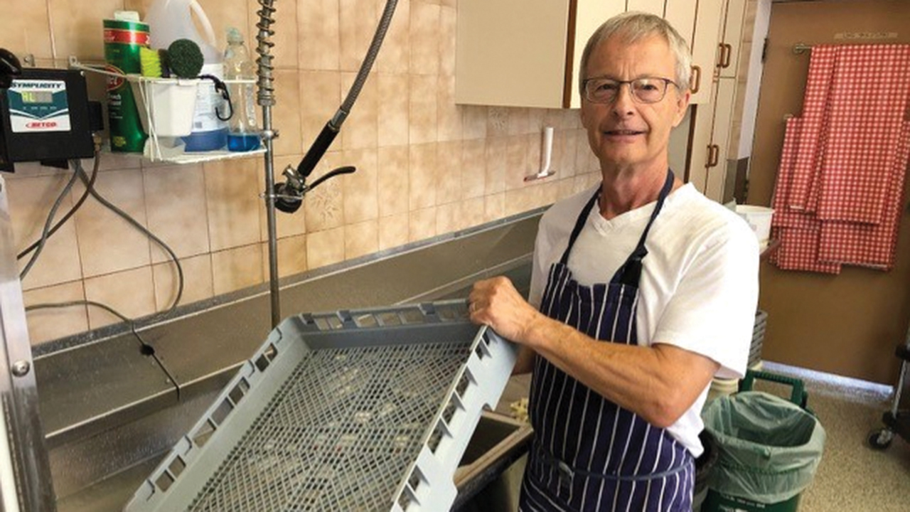 Bob Ratelle does clean up in the kitchen at Scott St. Church in St. Catharines, Ont., after making meals made possible by support from the MDS Canada Spirit of MDS Fund. — Mennonite Disaster Service