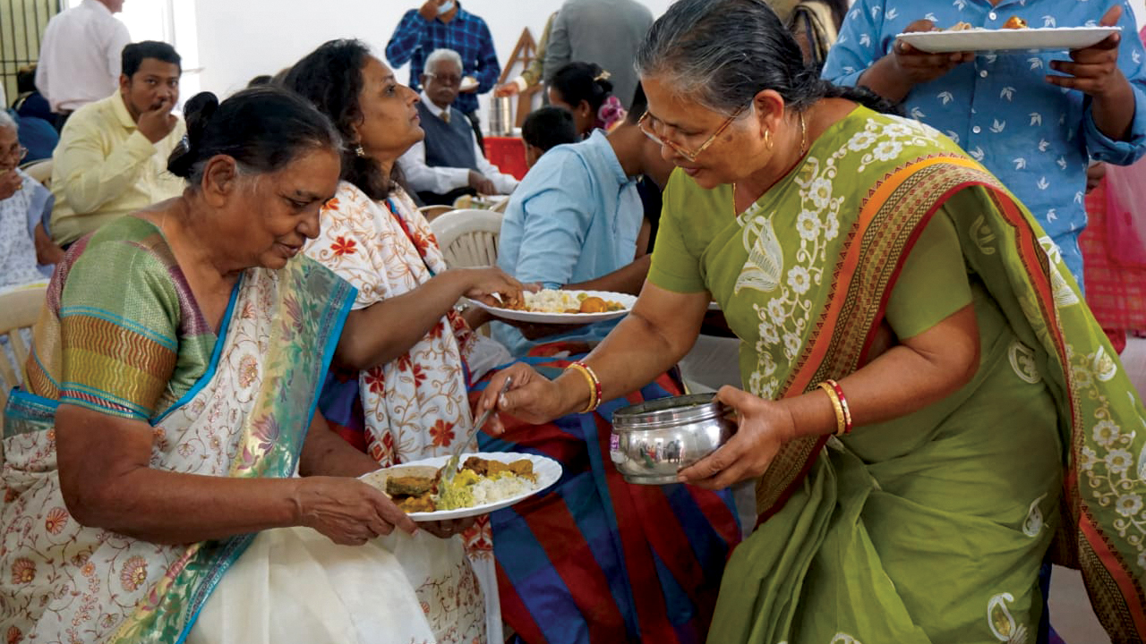 Members of Rajnandgaon Mennonite Church in India share a meal after their Anabaptist World Fellowship Sunday service. — Preshit Rao/MWC