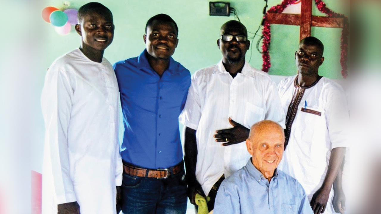 Beryl Forrester, seated, with Mennonite Church West Africa pastors, from left, Adriano MBackeh, Daniel Djin-ale, Gibby Mane and Sangpierre Mendy. — Eastern Mennonite Missions
