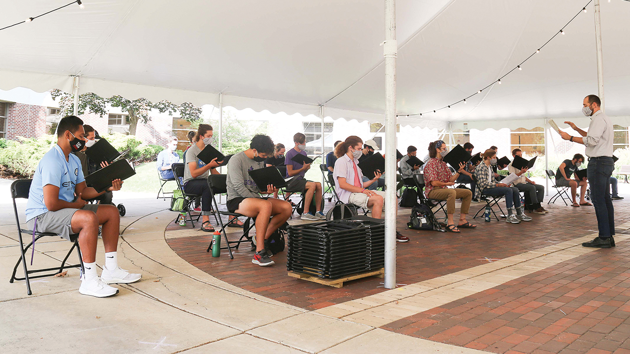 Goshen College’s Vox Profundi choral ensemble rehearses outdoors last fall. — Brian Yoder Schlabach/Goshen College