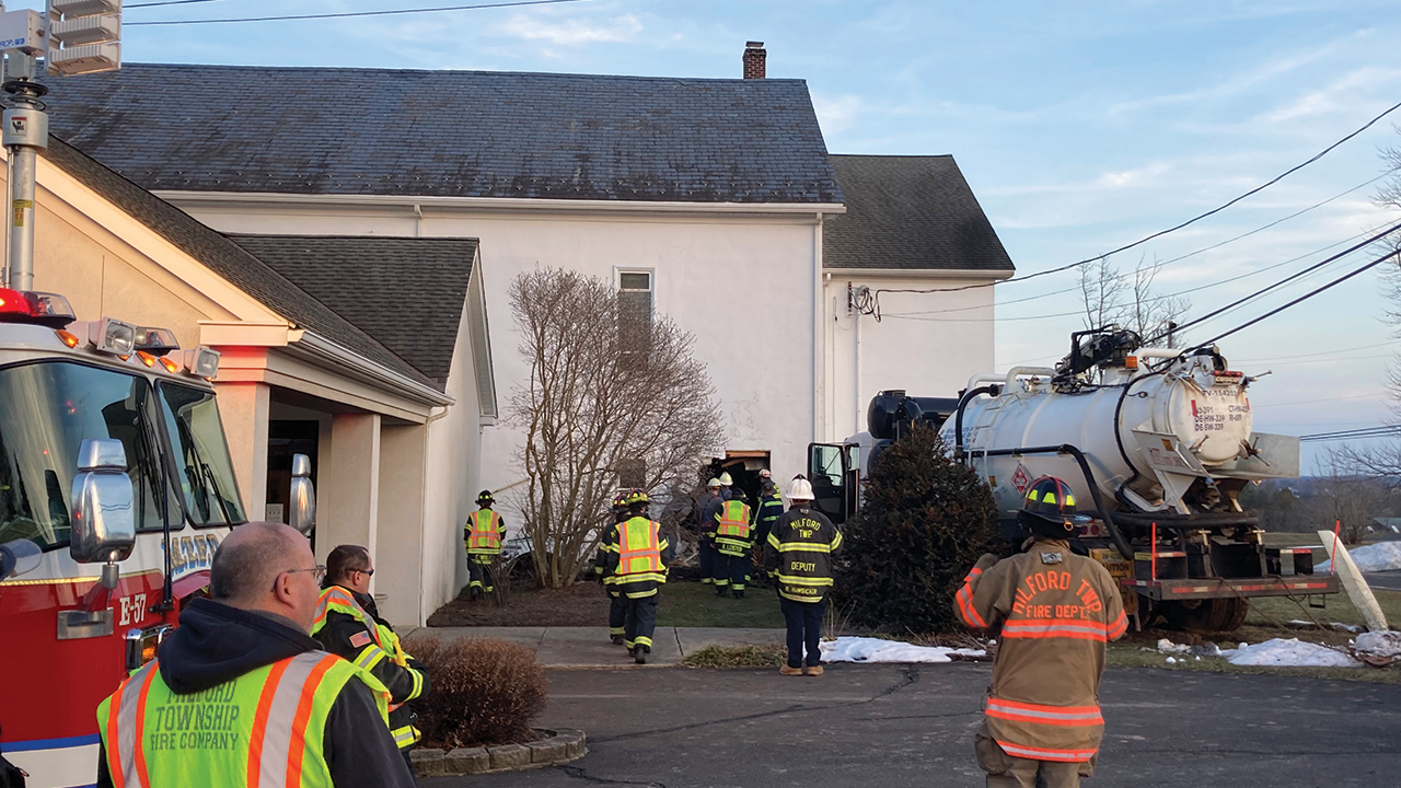 Numerous fire and police personnel were on the scene at West Swamp Mennonite Church on March 9 when a truck lost control and ran into the church building. — Sue Conrad Howes/Mosaic Mennonite Conference