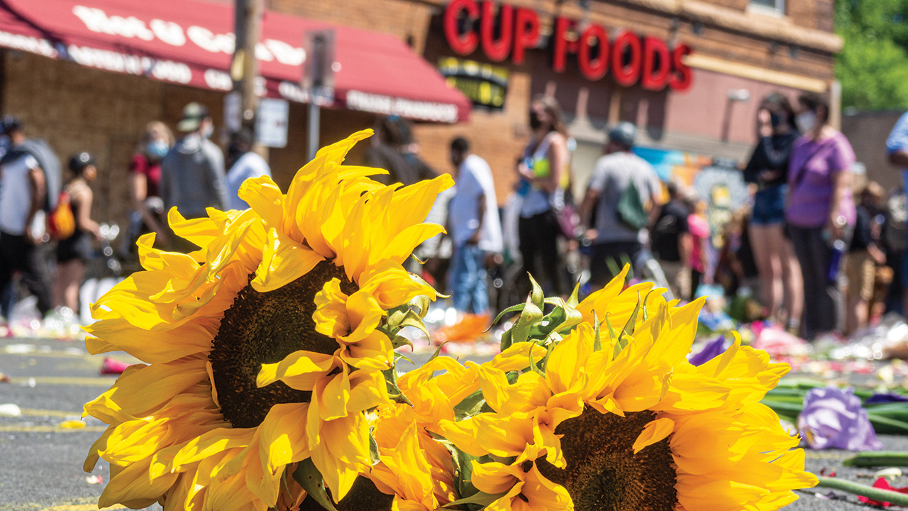 Flowers grace the memorial on May 30, 2020, where George Floyd died in Minneapolis. — Karla Hovde