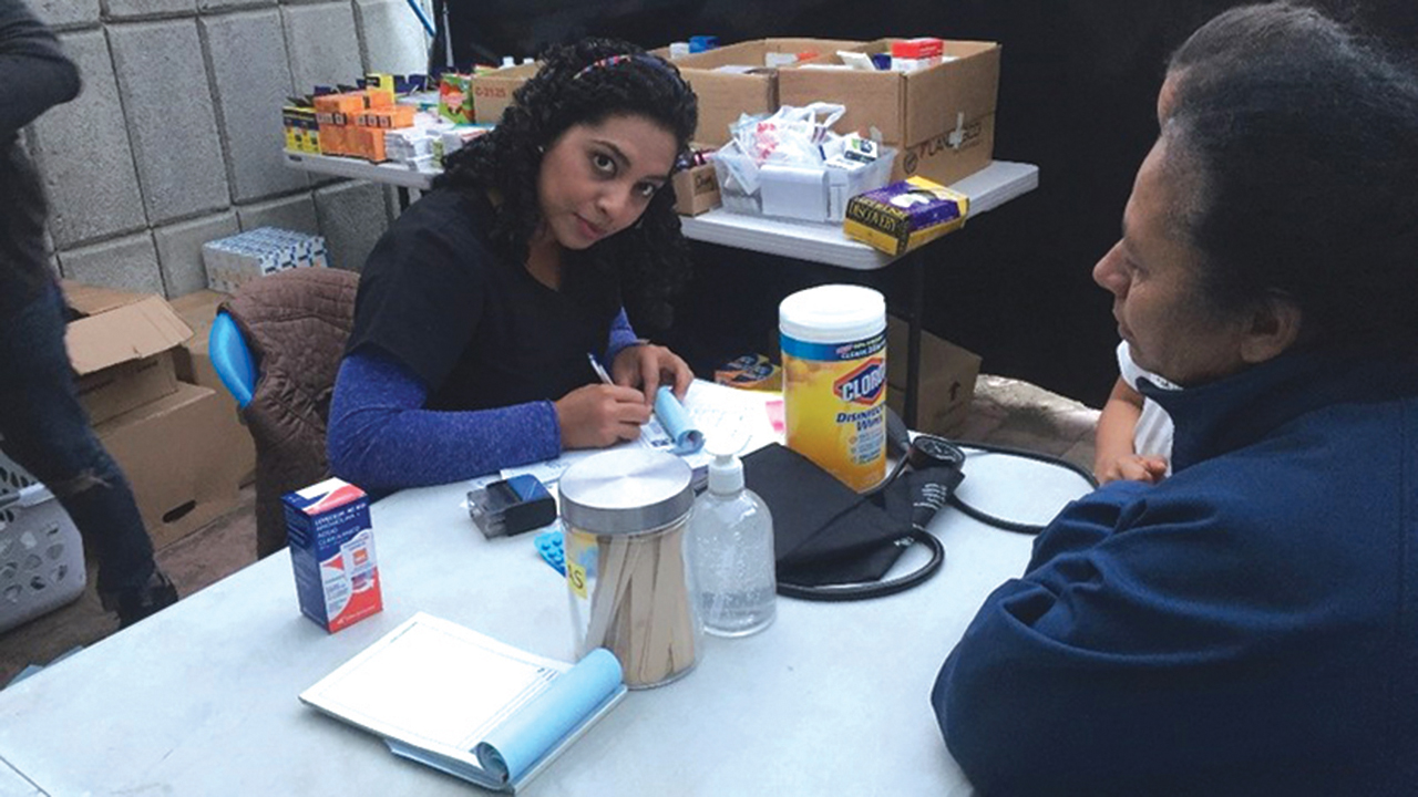 Ela Castro, a 2019-20 YAMEN participant, works in January 2020 at Casa del Migrante in Guatemala City. — Samuel Gaitan/Casa del Migrante