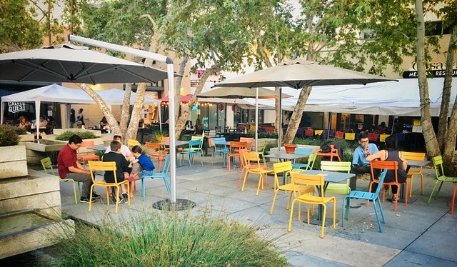 "A table for you" a Claremont Village scene by David Augsburger.