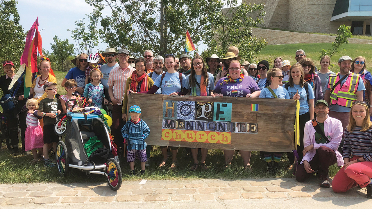 Members of two Winnipeg, Man., congregations — Hope Mennonite Church and River East Church, a Mennonite Brethren congregation — gather after participating in Winnipeg’s Pride parade in 2019. — Hope Mennonite Church