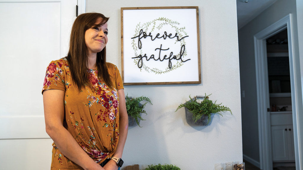 Lauren Collins enjoys her new home after unlocking the door for the first time. — Paul Hunt/MDS