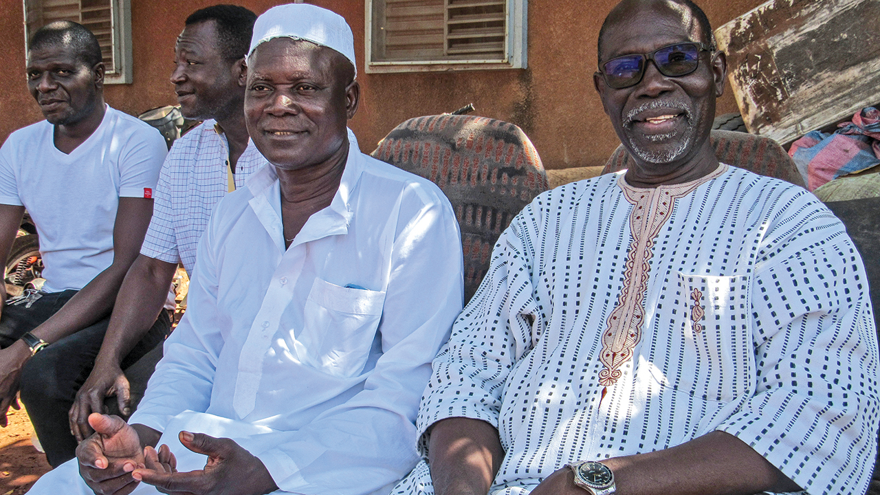 Ali Koro, left, and Siaka Traoré celebrate a fruitful effort to purchase a hearse in Bobo-Dioulasso, Burkina Faso. — Mennonite Mission Network