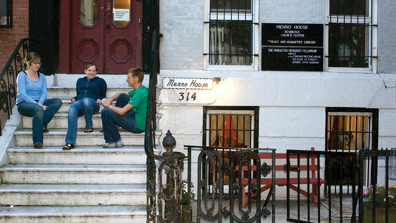 In 2006, Adriana Koehn, Amanda Talstra and Dan Talstra enjoy down time on the steps of Menno House, the Mennonite Voluntary Service unit that operated from 1995 to 2021. — Mennonite Mission Network