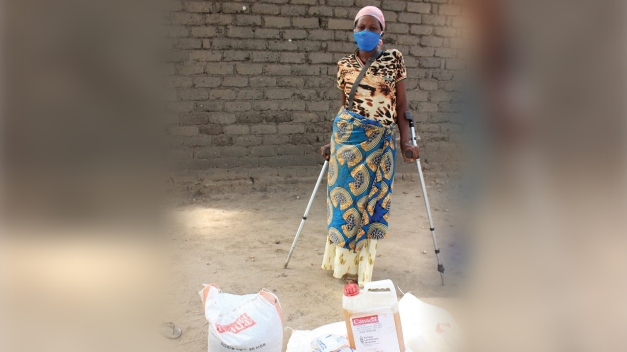 Buloze Bugonge of the Democratic Republic of Congo received food aid from an MCC partner amid rising prices during her recovery from an auto accident. — Kabamba Lwamba/MCC