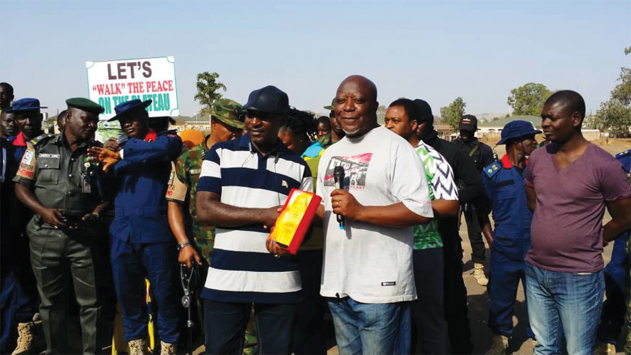 Chuwang Pam, right, does peacebuilding work in Nigeria. Photo: courtesy of Chuwang Pam