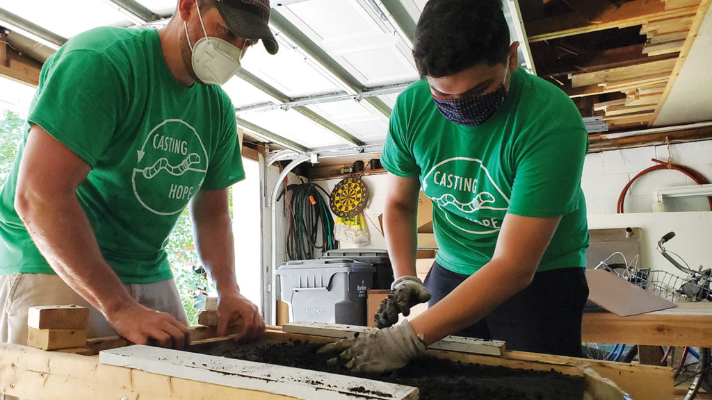 After castings are harvested from the worm box, Daniel Yoder and Jovan sift them to remove partially broken-down items and create a uniform vermicomposting (converting organic waste into fertilizer using earthworms) product. — Daniel Yoder