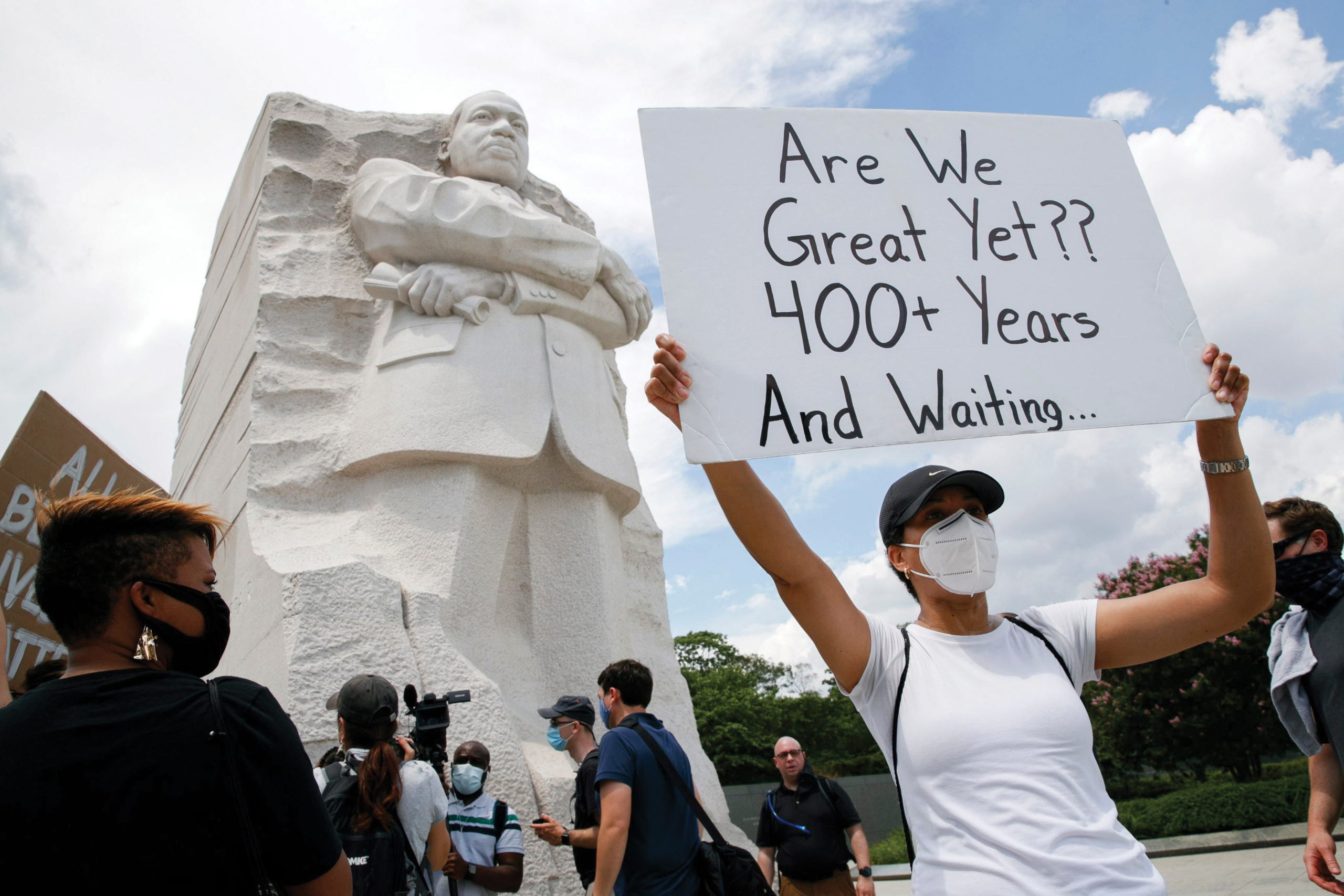 Kimya Hogarth of Silver Spring, Md., takes part in a protest in Washington at the Martin Luther King Jr. Memorial on June 19, 2020, to mark Juneteenth, the holiday celebrating the day in 1865 that enslaved black people in Galveston, Texas, learned they had been freed from bondage, more than two years after the Emancipation Proclamation. — Jacquelyn Martin/AP