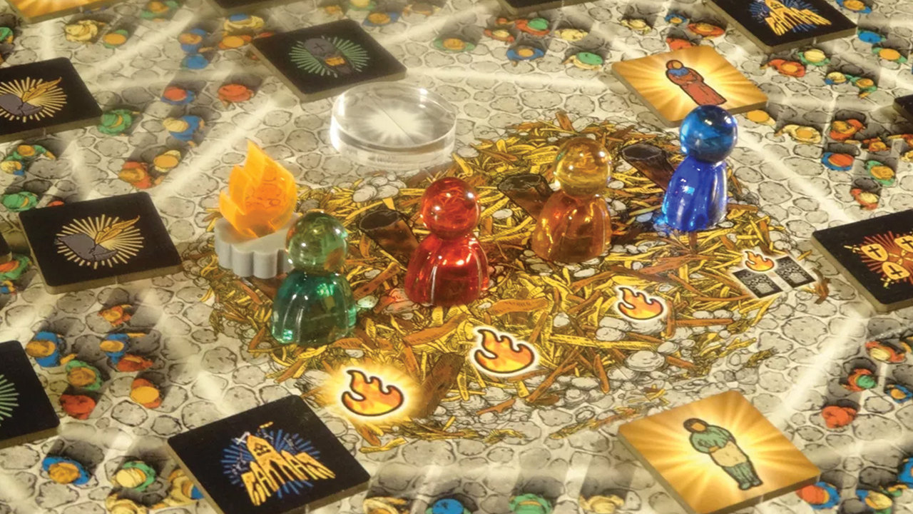 Martyr game pieces sit in the town square at the center of the game board. — John Ratigan