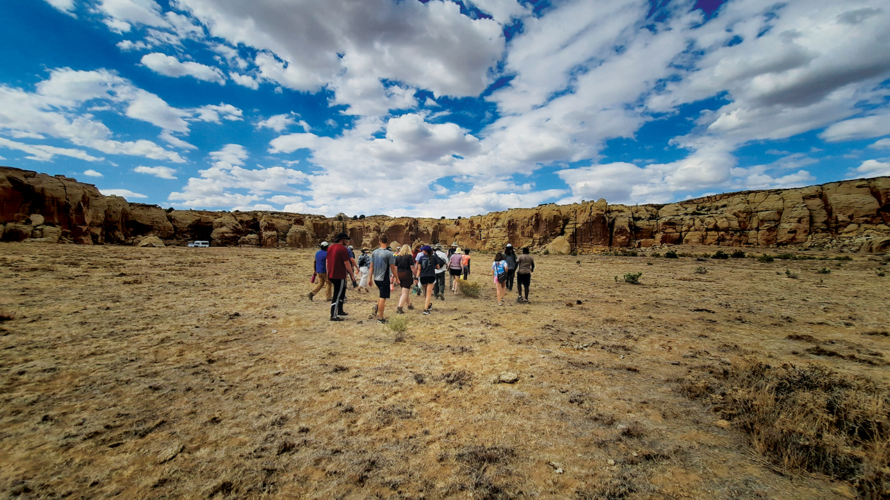 Goshen College students wander between the rock canvases at Petroglyph Canyon in Arizona. — David Lind/Goshen College
