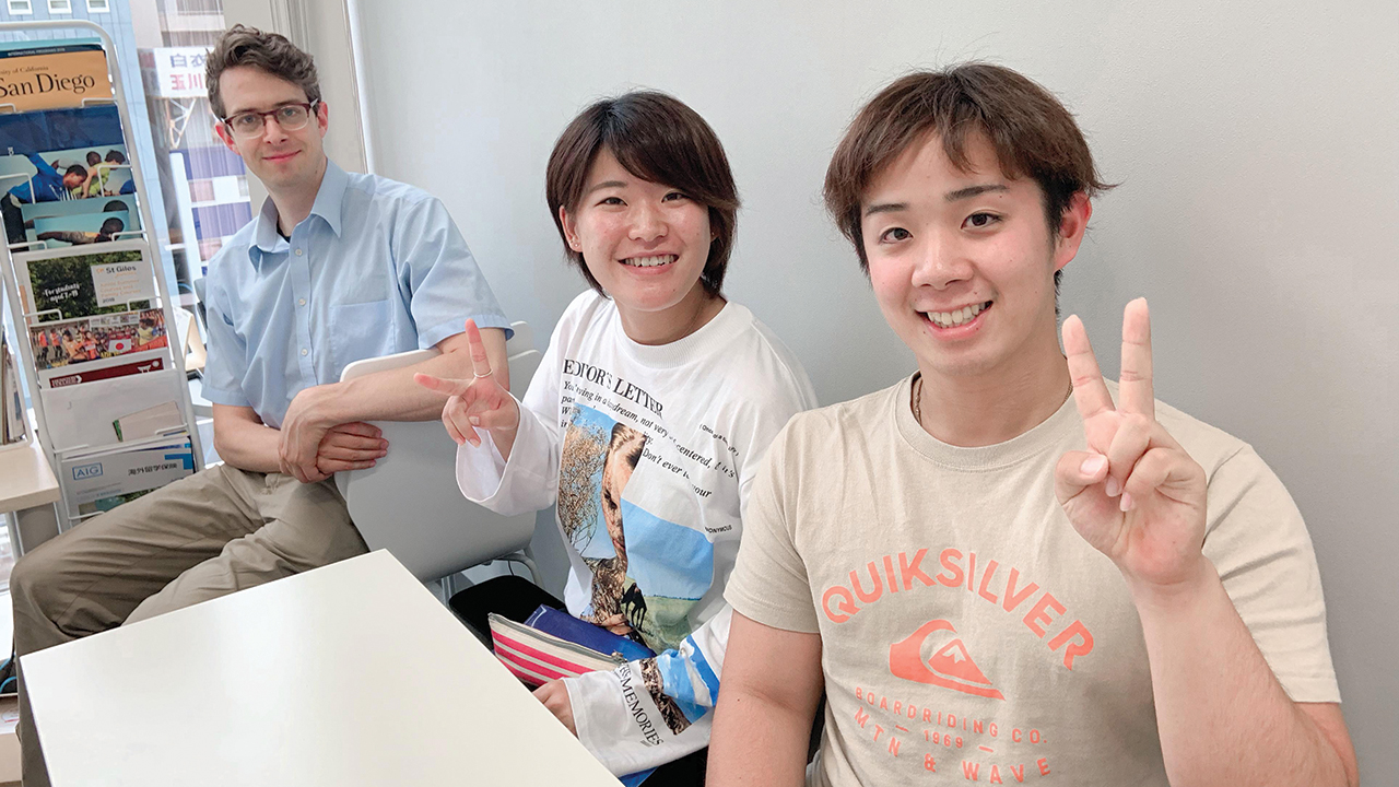Students Den Morita, middle, and Shoei Imaizumi meet in Tokyo for intensive English coursework with Hesston College professor André Swartley in June 2019. — André Swartley/Hesston College