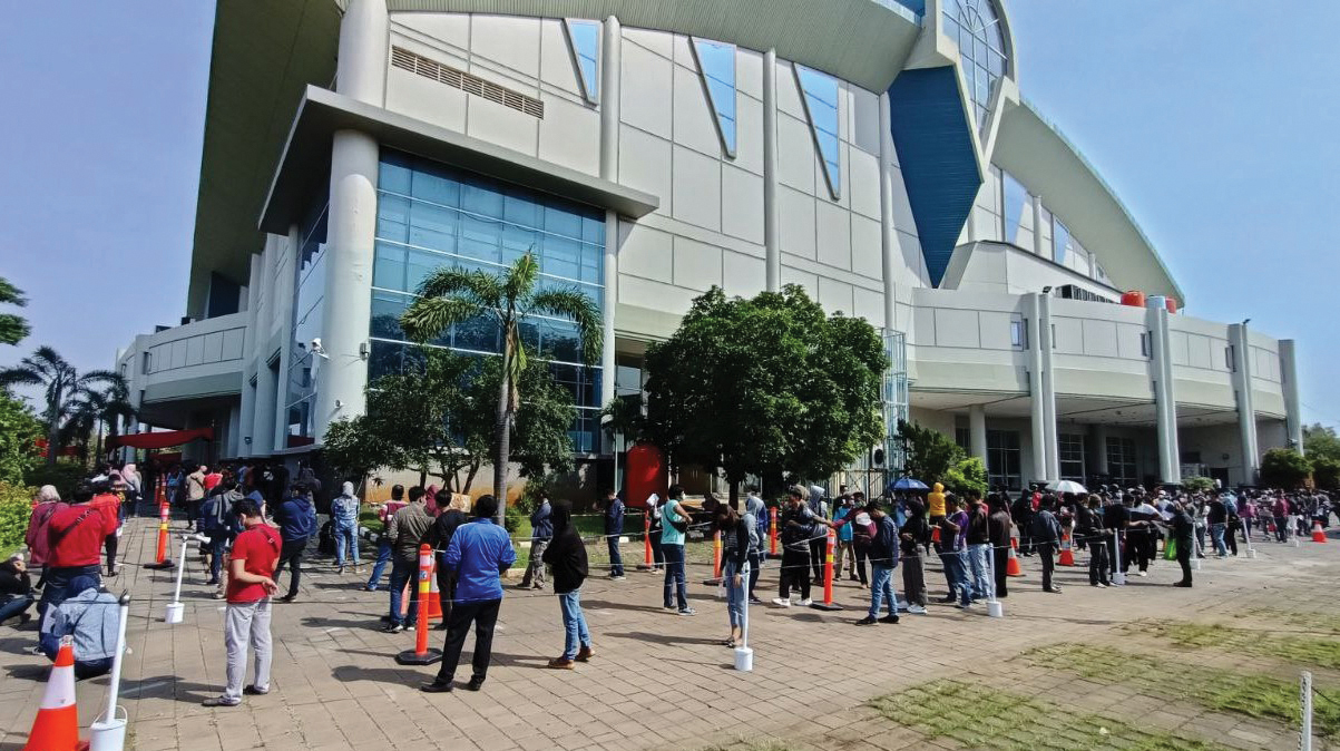 Mennonite World Conference’s Global Church Sharing Fund helps workers at Holy Stadium in Semarang, Indonesia, offer vaccines amid a COVID-19 infection wave. — MWC