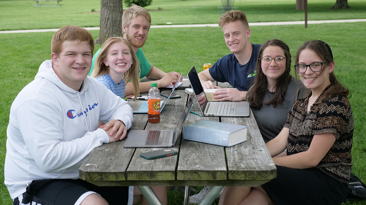 Students Lakota Mast, Rashae Byler, Jace Weber, Matt Mullen, Chloe Conn and Jalisa Schrock gather for an outdoor study session last spring. — Rosedale Bible College