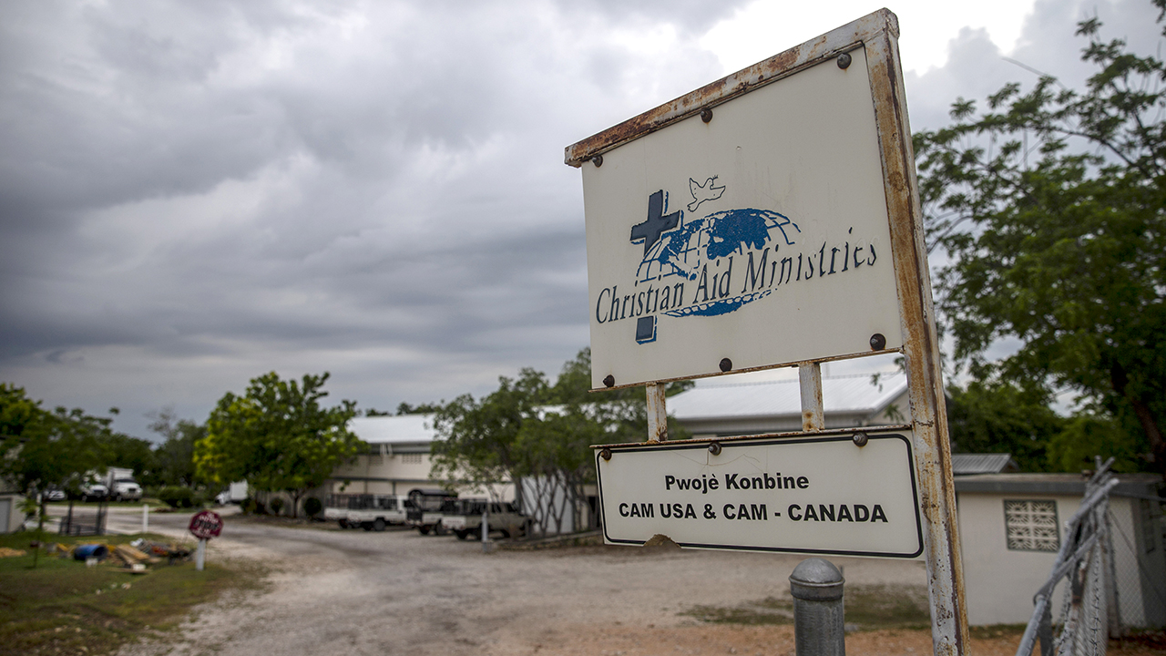 A sign stands outside Christian Aid Ministries in Titanyen, north of Port-au-Prince, Haiti. A gang kidnapped 17 members of the U.S.-based mission group on Oct. 16, demanding $1 million ransom per person. — Joseph Odelyn/AP