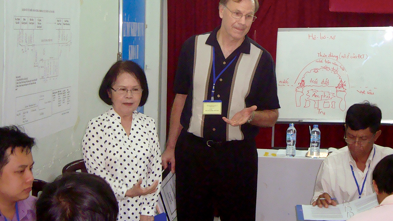 Tran Thi Phuoc Ly, left, translates while Gerry Keener teaches students in 2009. — Gerry Keener