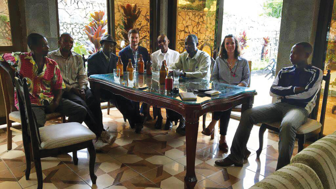 Michael Sharp and Zaida Catalán meet with interpreters and tribal leaders on March 11, 2017, the day before they were murdered. — Property of the Moresby family, used with permission of Maria Moresby