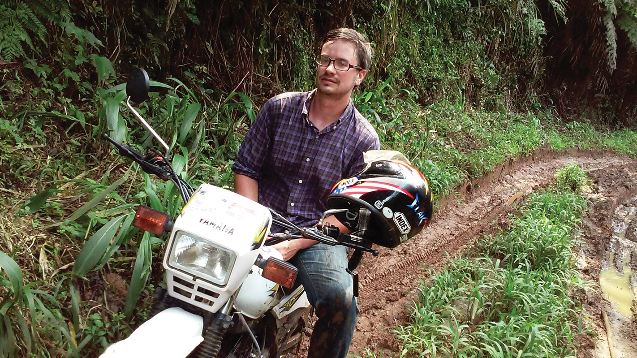 Michael Sharp after traveling the rough roads of the Democratic Republic of Congo by motorcycle. — Mennonite Central Committee