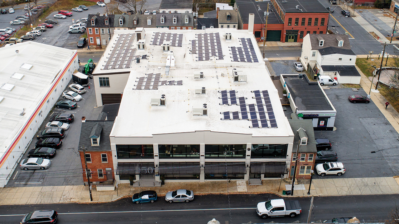 The 150 solar modules at Eastern Mennonite Mission’s Hub 450 property will generate 73,800 kilowatt hours of energy a year, about half of the facility’s energy needs. — Bob Buzzard/MVE Group