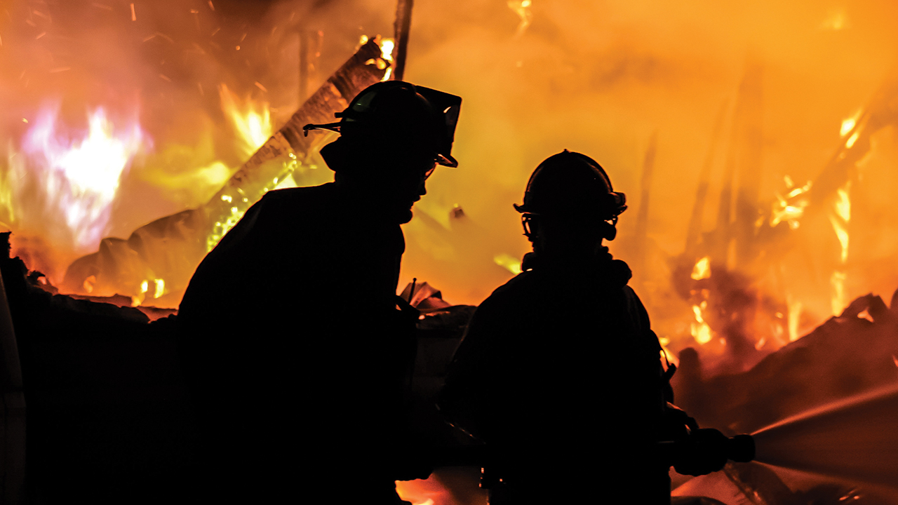 Firefighters contain the blaze Feb. 12 at Laurelville Retreat Center’s maintenance building. — James Brooks/USAF Fire Photography