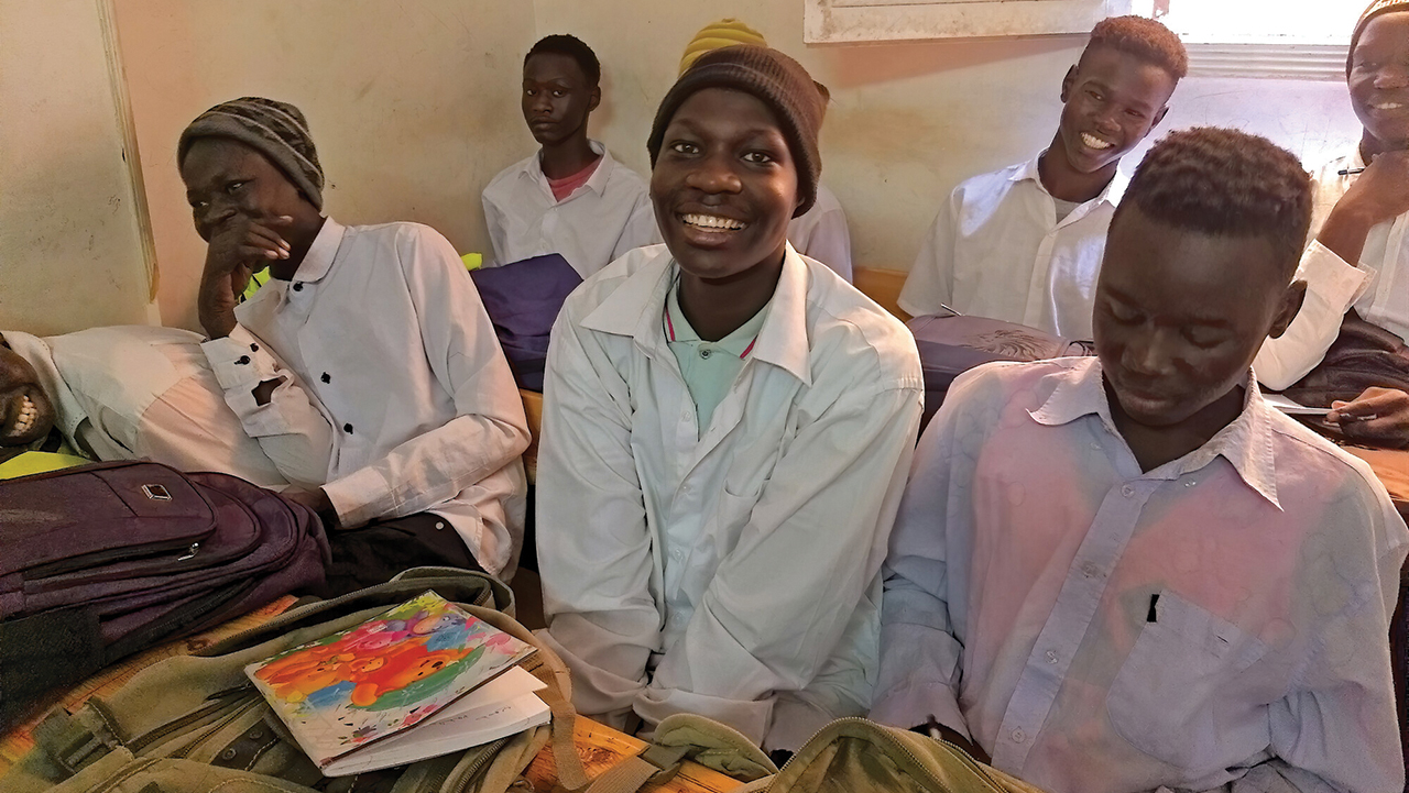 Raymond Khaled John Al-Hajana, center, a Sudanese refugee, is studying at St. Raphael Center for Basic and Secondary Education in Egypt. — Monica Mehaffey/Refuge Egypt