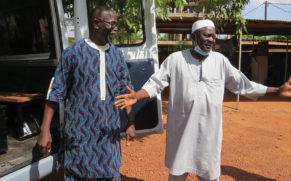 Mennonite pastor Siaka Traoré and Muslim leader Ali Traoré dedicate the van their communities bought and converted into a hearse. — Lynda Hollinger-Janzen/MMN