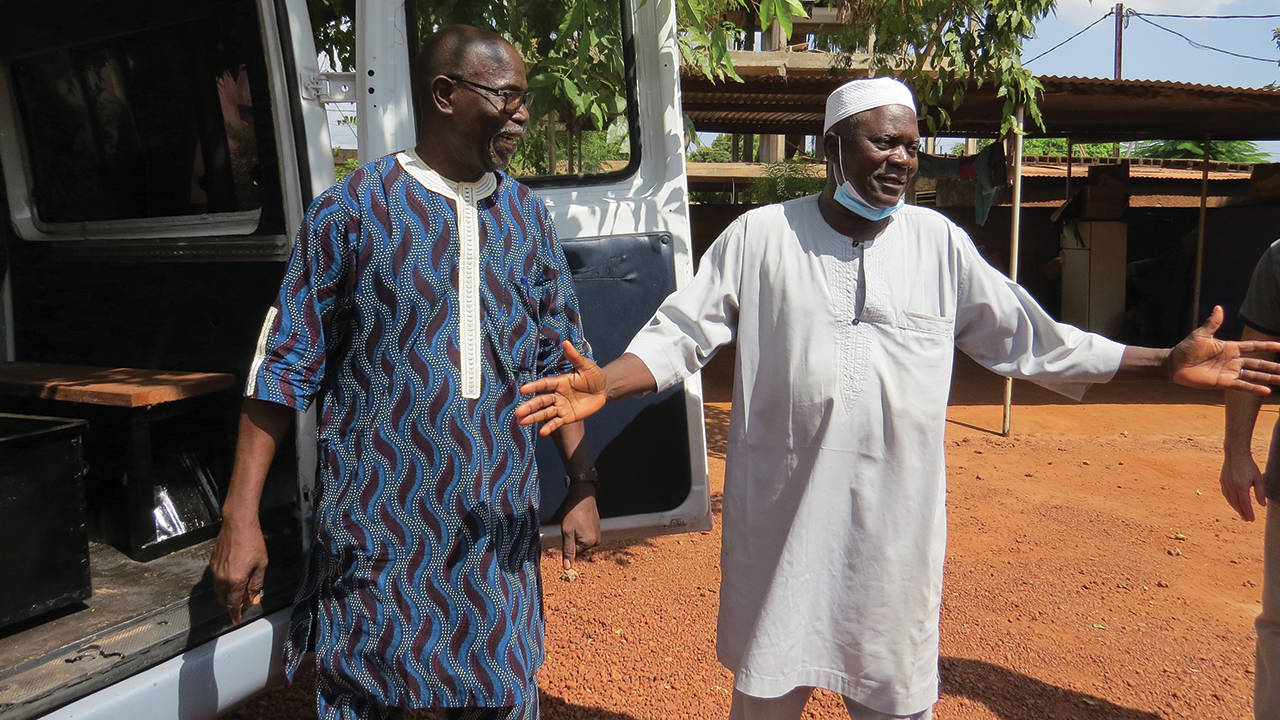 Mennonite pastor Siaka Traoré and Muslim leader Ali Traoré dedicate the van their communities bought and converted into a hearse. — Lynda Hollinger-Janzen/MMN