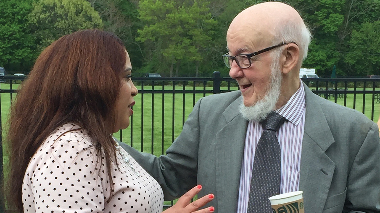 Monroe Yoder talks with Melody Pannell of Harrisonburg, Va., in 2019. Pannell grew up in Seventh Avenue Mennonite Church in Harlem, N.Y., where Yoder was the pastor. — Melody Pannell