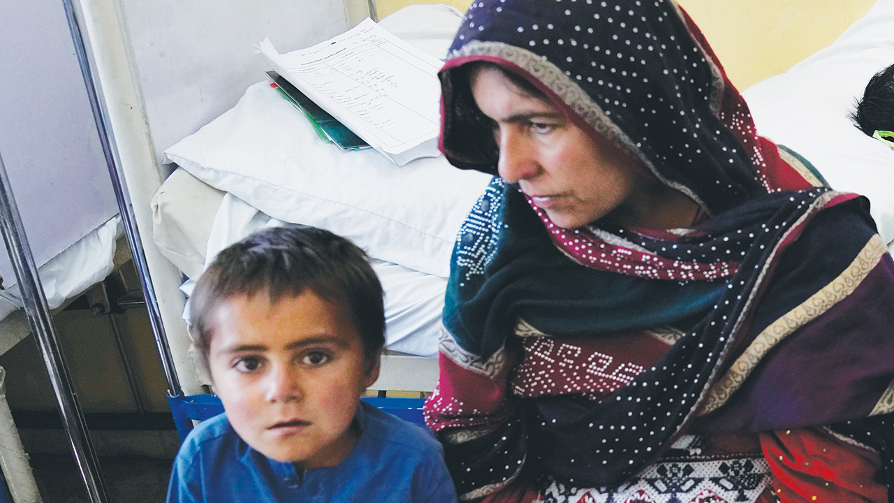 An Afghan mother and child in the malnutrition ward of the Indira Gandhi Children’s Hospital, in Kabul, Afghanistan, Feb. 24. According to U.N. projections for 2022, over 1 million Afghan children will need treatment for malnutrition, and up to 97% of Afghans could be living below the poverty line. — Hussein Malla/AP
