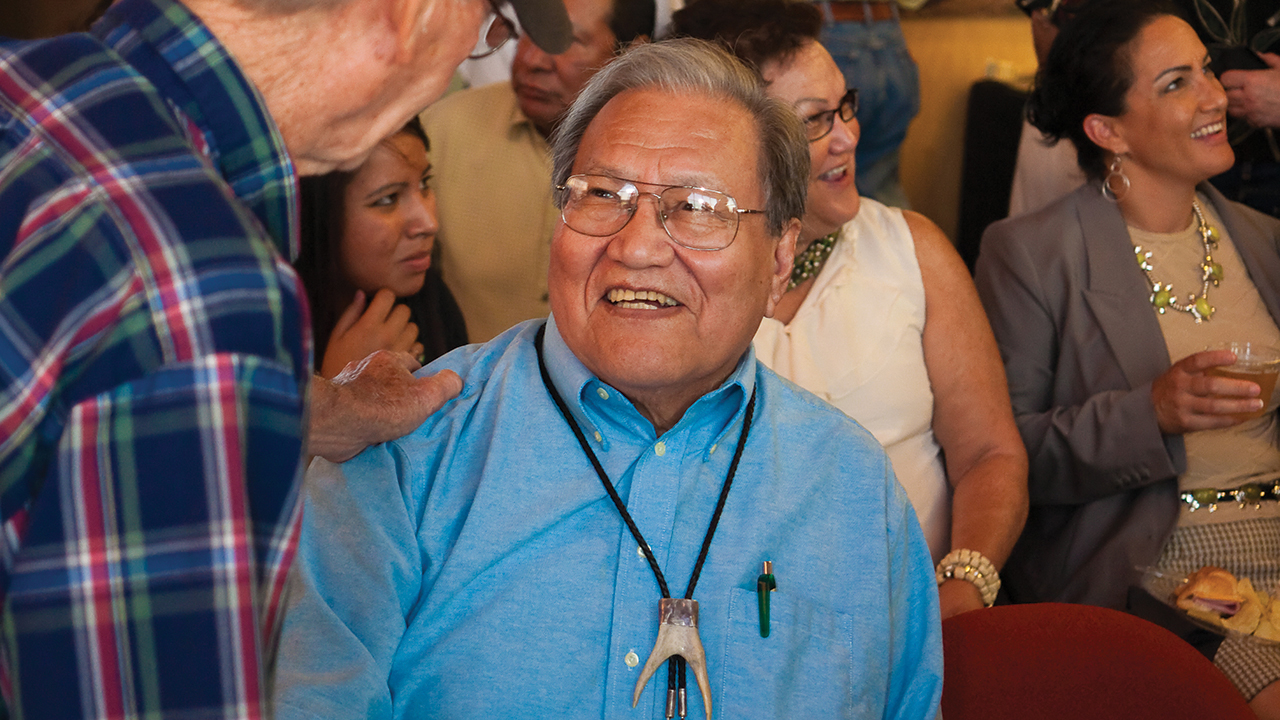 Lawrence Hart greets a well-wisher during an event in his honor hosted by the National Park Service at the Washita Battlefield National Historic Site at Cheyenne, Okla., on Aug. 28, 2010. Behind him, from left, are granddaughter Christina Yellowman, daughter Connie Hart Yellowman and daughter Cristina Hart Wolfe. — National Park Service